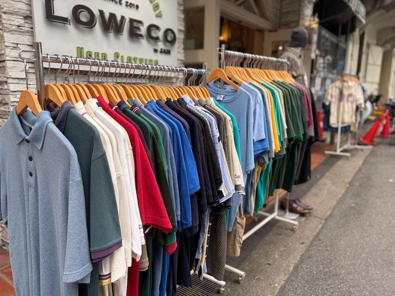 Rack of second-hand colorful shirts displayed outside LOWECO vintage store in Nakazakicho