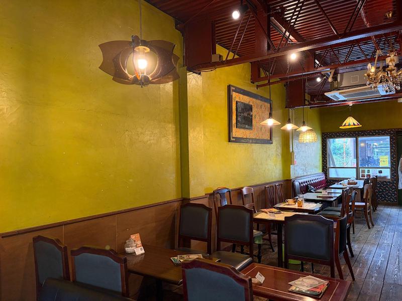 Showa retro interior with yellow-green walls and antique lighting at Cafe Taiyo no To