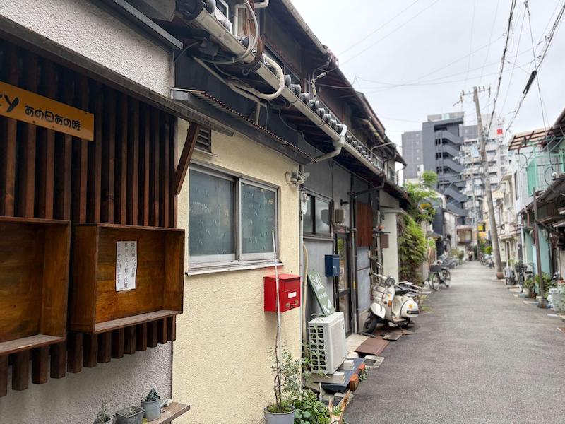 Traditional wooden houses in Nakazakicho with modern high-rise skyscraper in the background